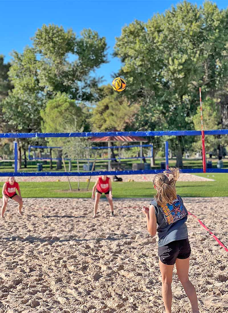 Players competing in a beach volleyball tournament